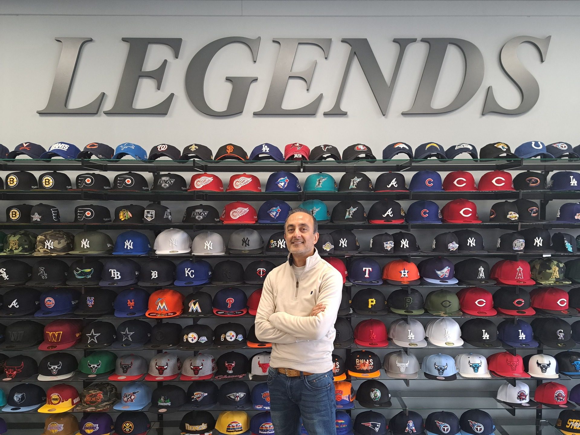 legends shop fornt view men on front of the hats